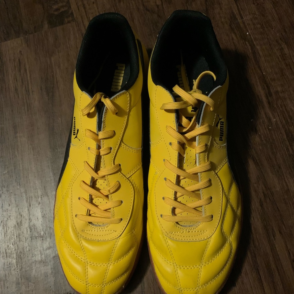 Yellow pumas.  15 yrs old never worn